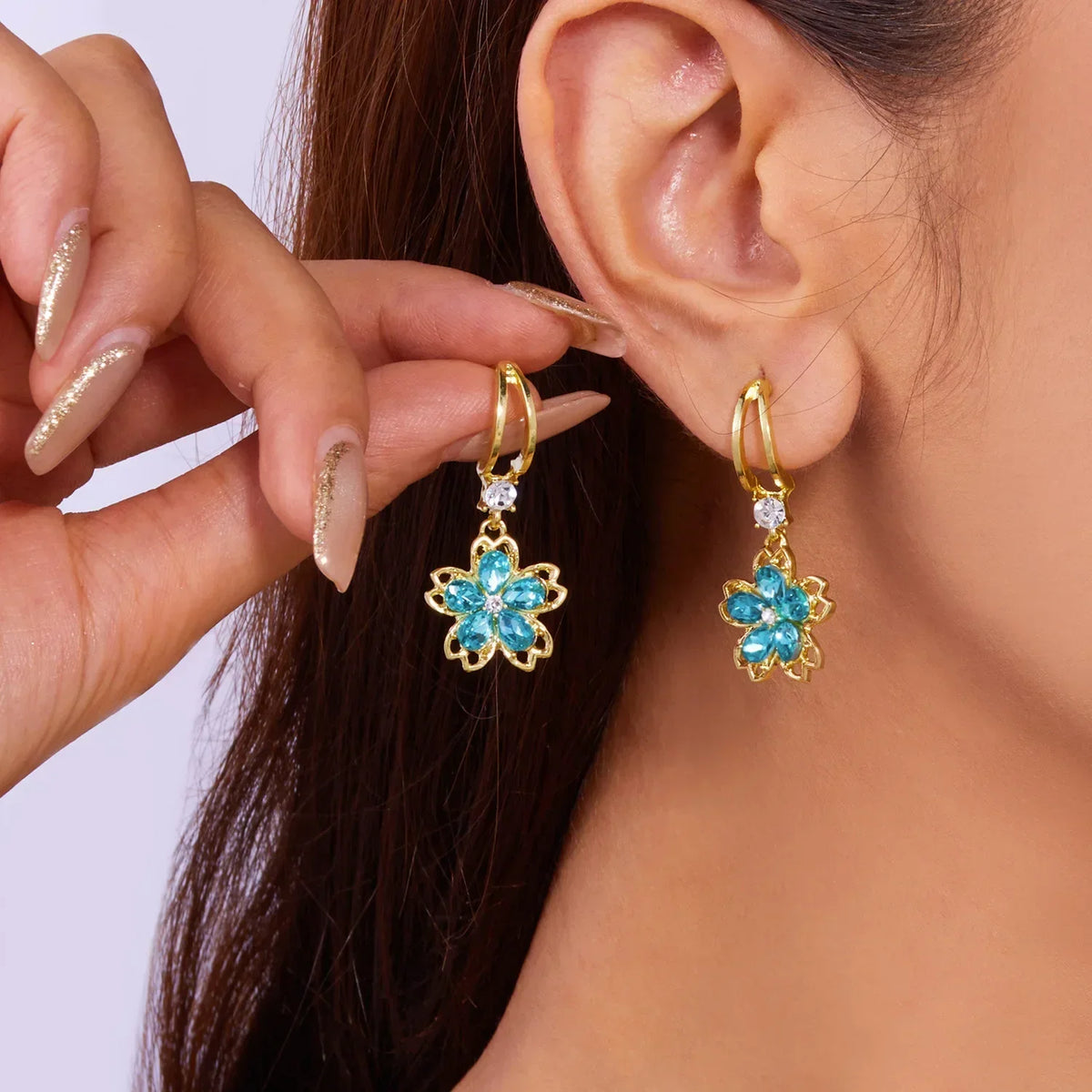 Long crystal drop tassel earrings featuring dangling beads, designed by Corporación Turística, elegant jewelry accessory.