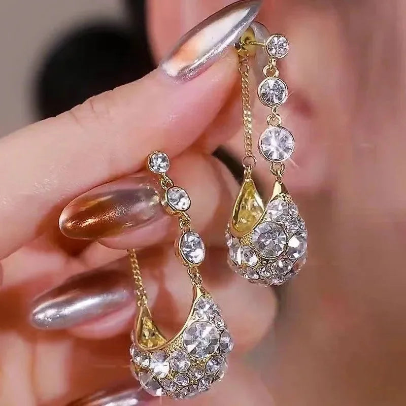 Long crystal drop tassel earrings with colorful beads, elegant jewelry accessory from Corporación Turística.