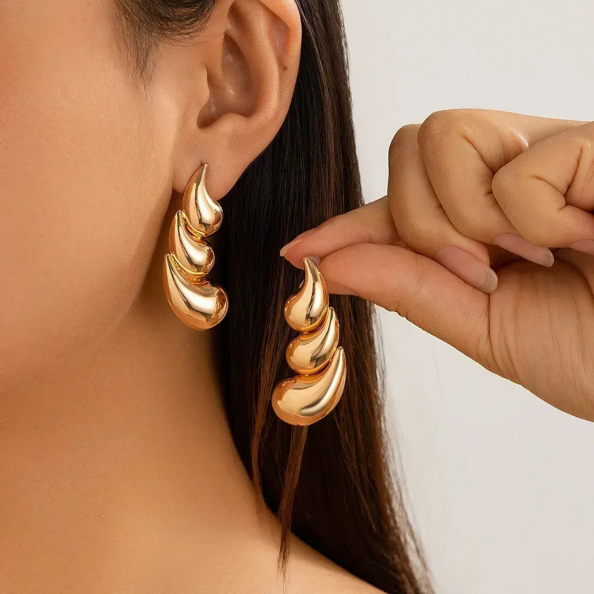 Long crystal drop tassel earrings with shimmering crystal beads, designed by Corporación Turística.