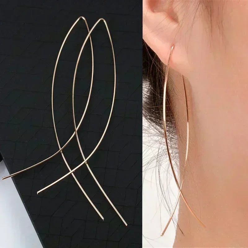Long crystal drop tassel earrings featuring glass beads, designed by Corporación Turística.