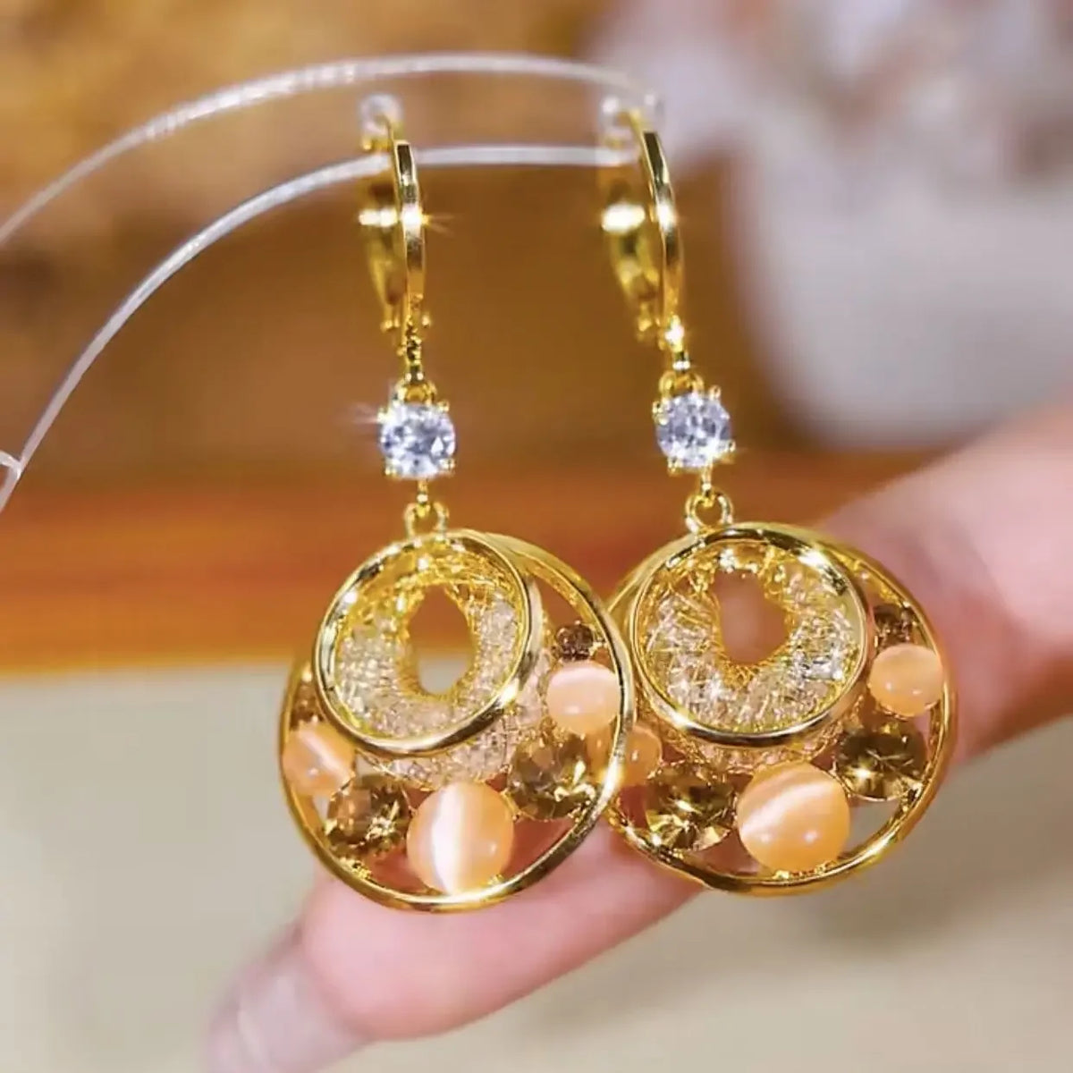 Exquisite eye of the tiger stone dangling earrings from Corporación Turística, featuring elegant gemstone pendants.