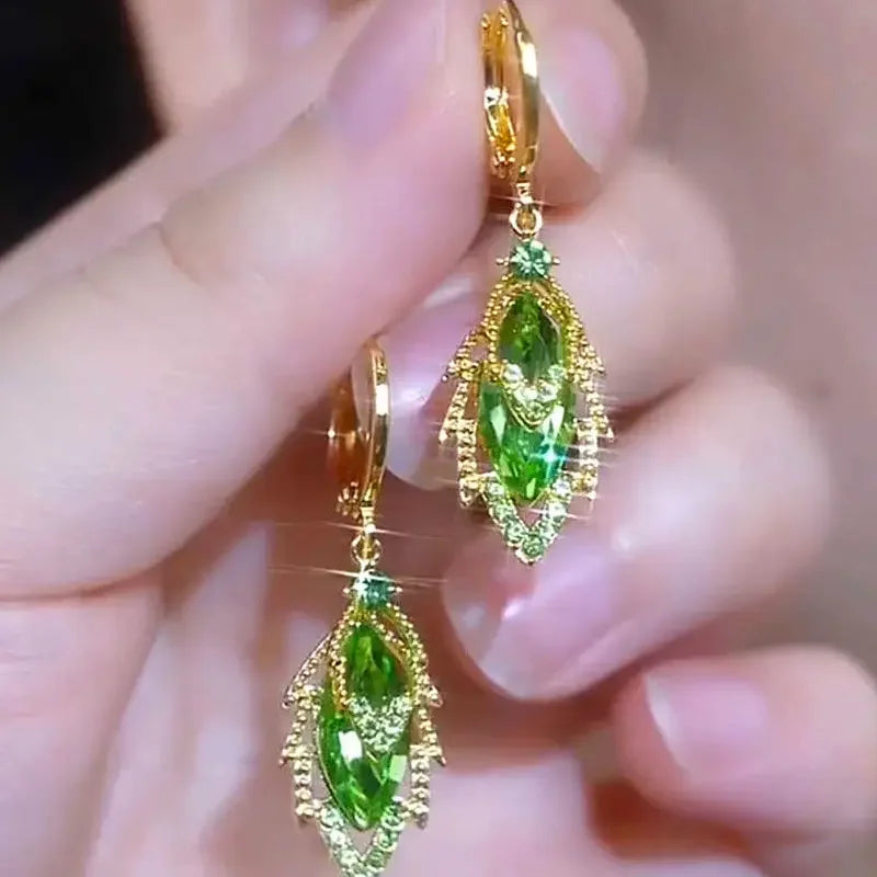 Elegant crystal pendant earrings from Corporación Turística, featuring delicate dangling design with sparkling crystal accents.