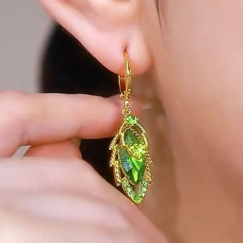 Elegant dangling crystal earrings by Corporación Turística featuring intricate circular crystal pendants.