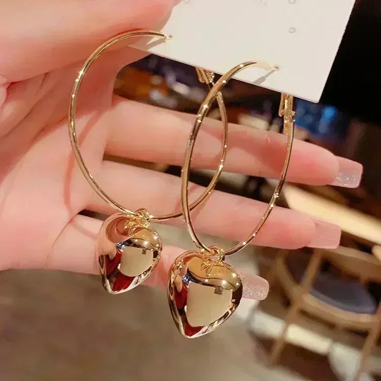 Gold leaf crystal green earrings for women with elegant leaf design, featuring sparkling green crystal accents.
