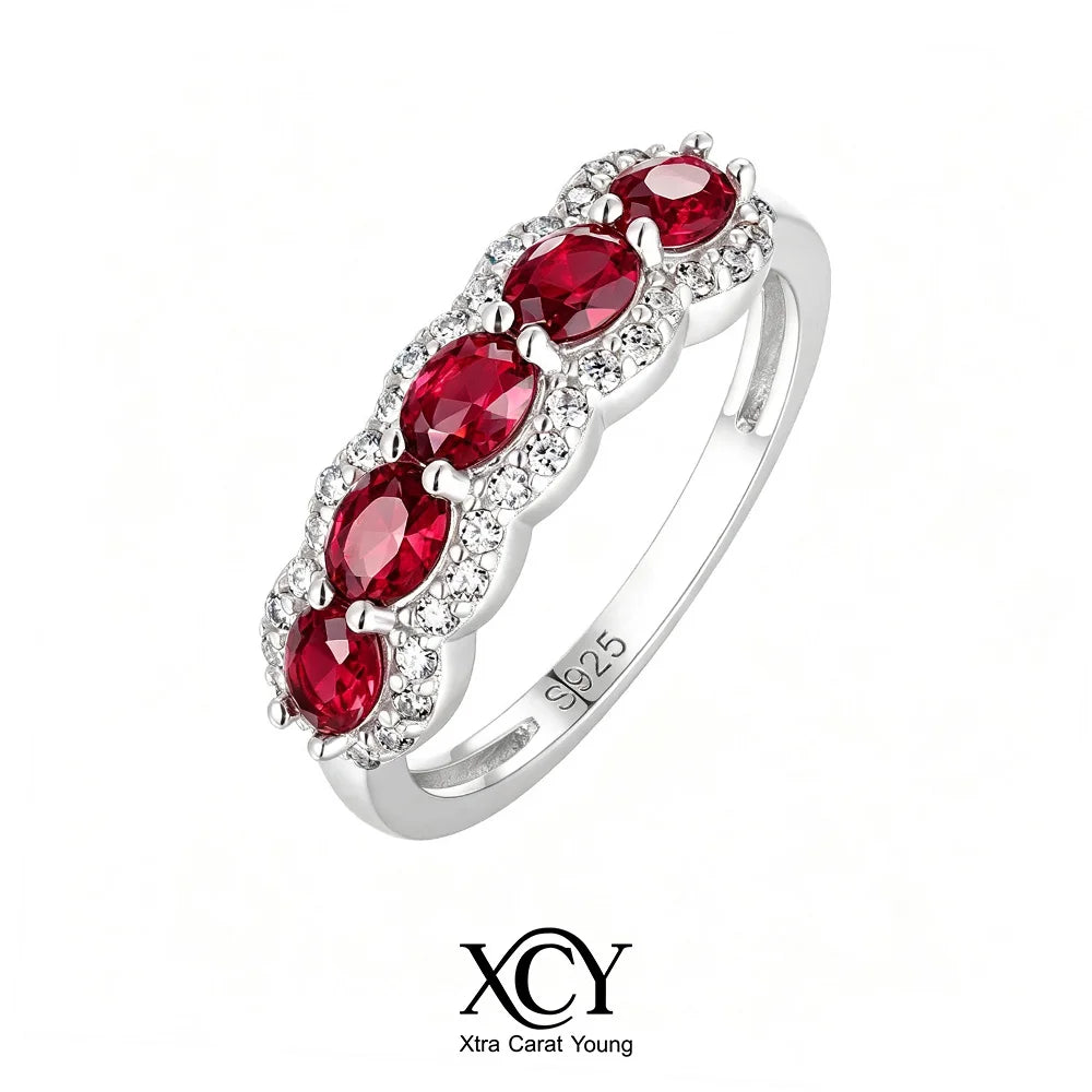 Oval-shaped XCY ring with simulated emerald for women, crafted in white gold, featuring a sleek and elegant design.