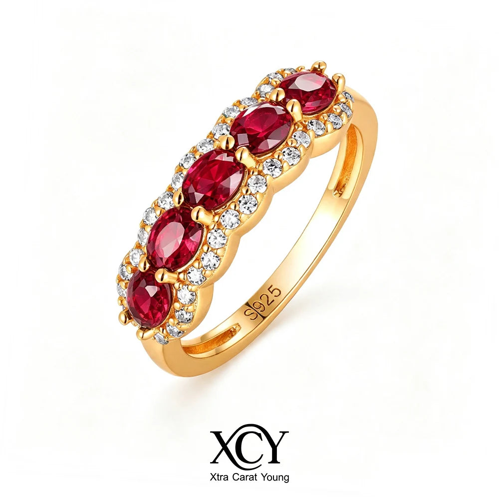Oval-shaped XCY ring for women with simulated emerald, featuring white gold plating and elegant design.