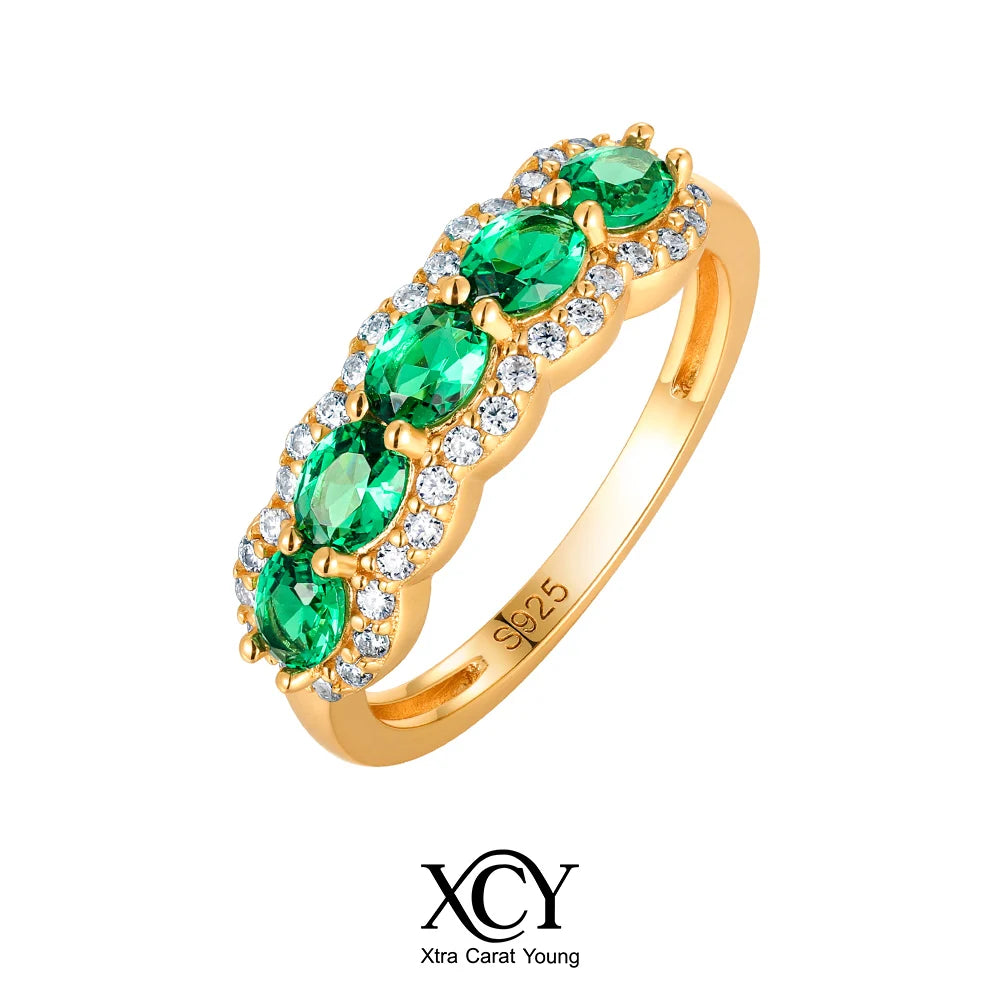 Oval-shaped XCY ring for women with simulated emerald, set in white gold, featuring elegant craftsmanship and sparkling details.