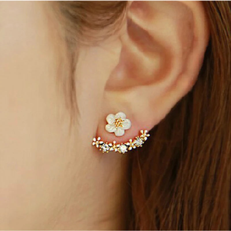 Elegant floral earrings from Corporación Turística, showcasing delicate flower designs in a stylish jewelry piece.