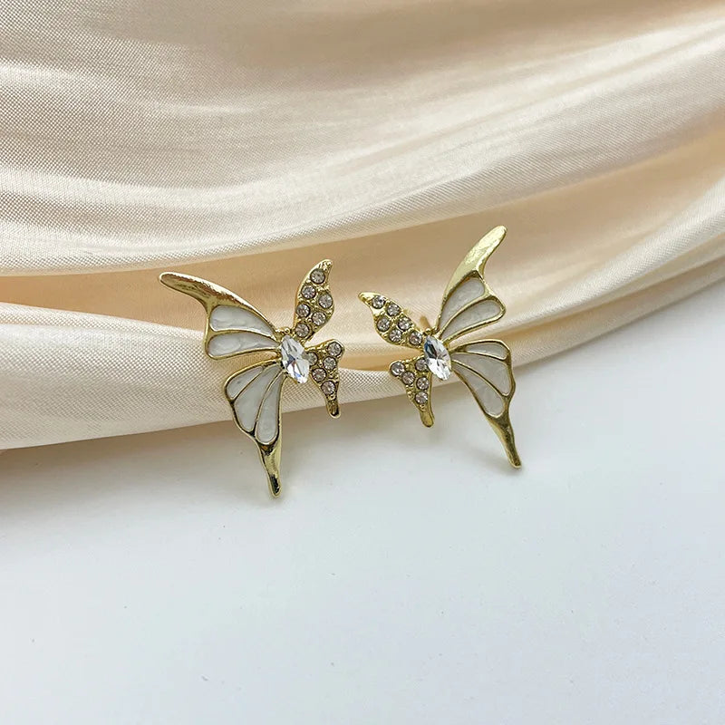 Elegant butterfly-shaped fashion earrings for women featuring intricate design and vibrant colors, perfect for stylish occasions.