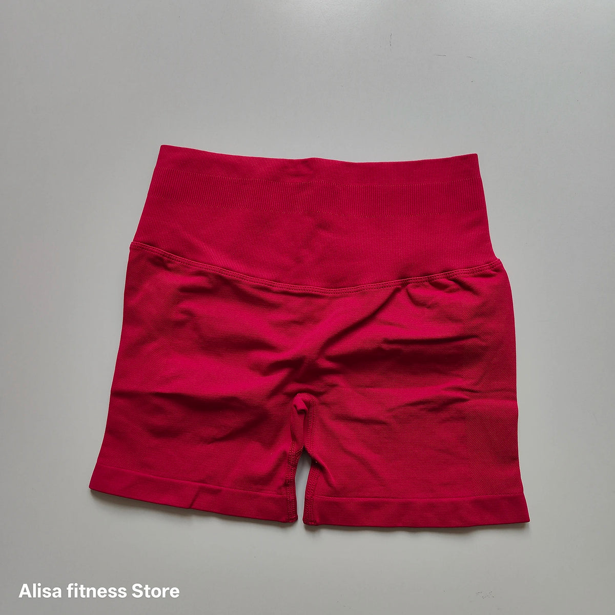 Dark gray high-waist yoga shorts by Corporación Turística, seamless design, perfect for summer workouts and active wear.