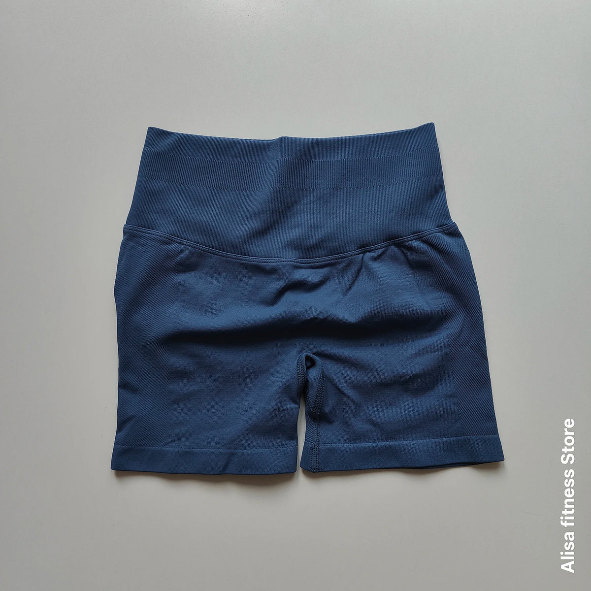 Dark gray high-waisted yoga shorts from Corporación Turística, seamless design, perfect for summer workouts and active wear.