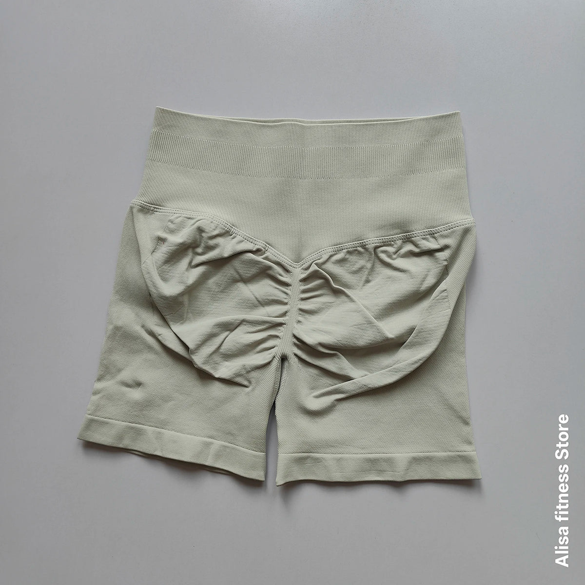 Dark gray high-waisted yoga shorts by Corporación Turística, seamless design, perfect for summer workouts.