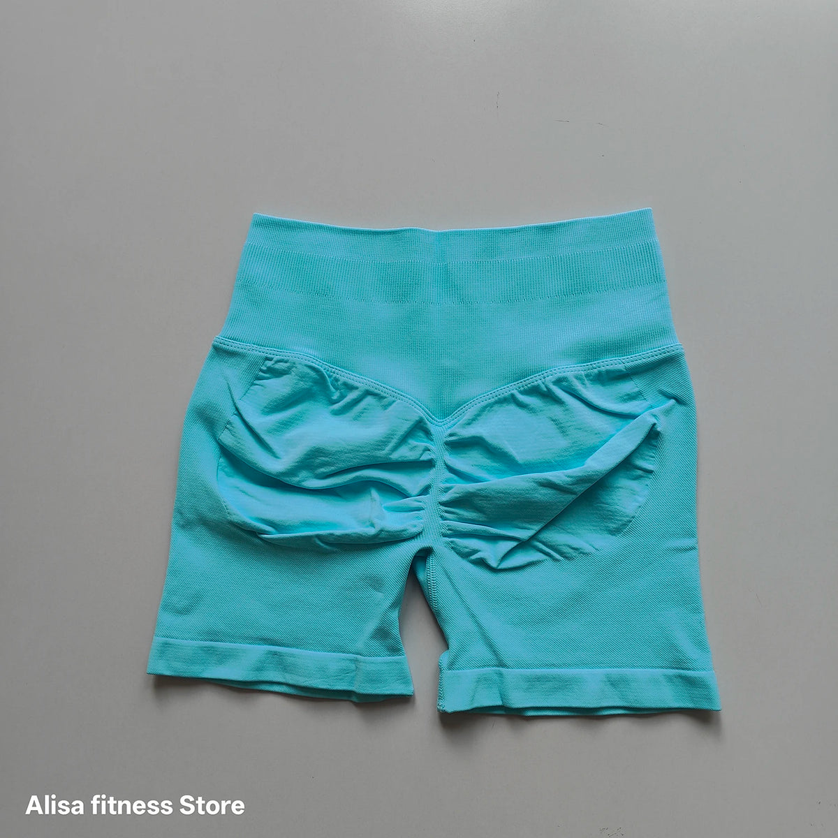 Dark gray high-waist yoga shorts by Corporación Turística, seamless design, perfect for summer workouts and active wear.