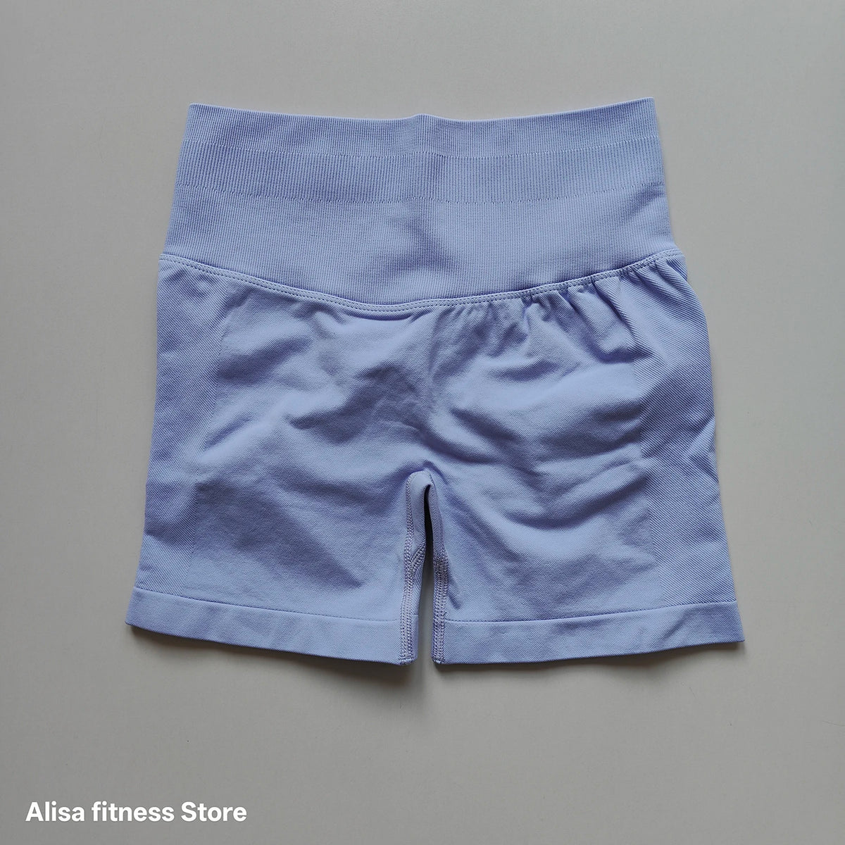 Dark gray high-waist yoga shorts for summer, seamless design by Corporación Turística, suitable for activewear and comfortable movement.