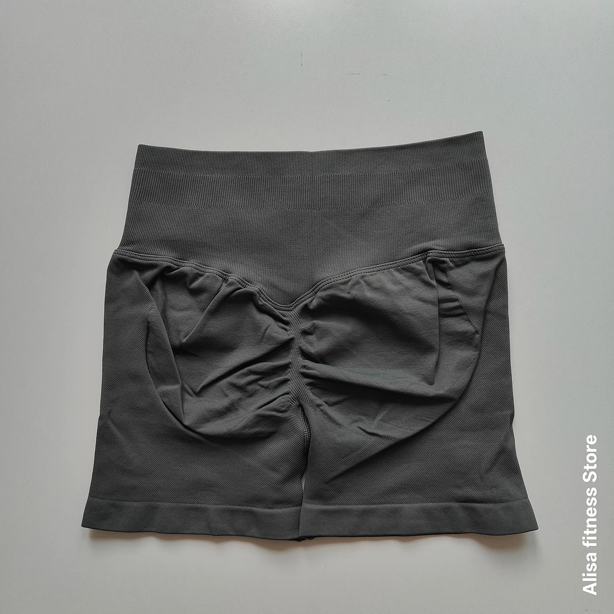 Dark gray high-waist yoga shorts by Corporación Turística, seamless design, ideal for summer workouts and activewear.