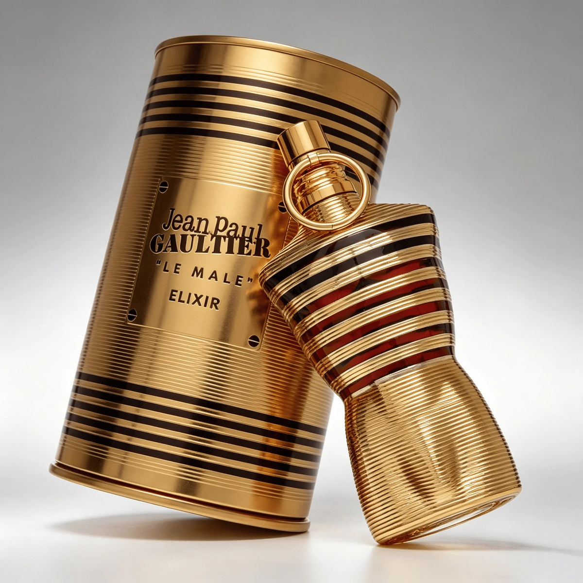 Unisex Jean Paul Gaultier Le Beau Elixir Parfum bottle with sleek design, displayed on a neutral background.