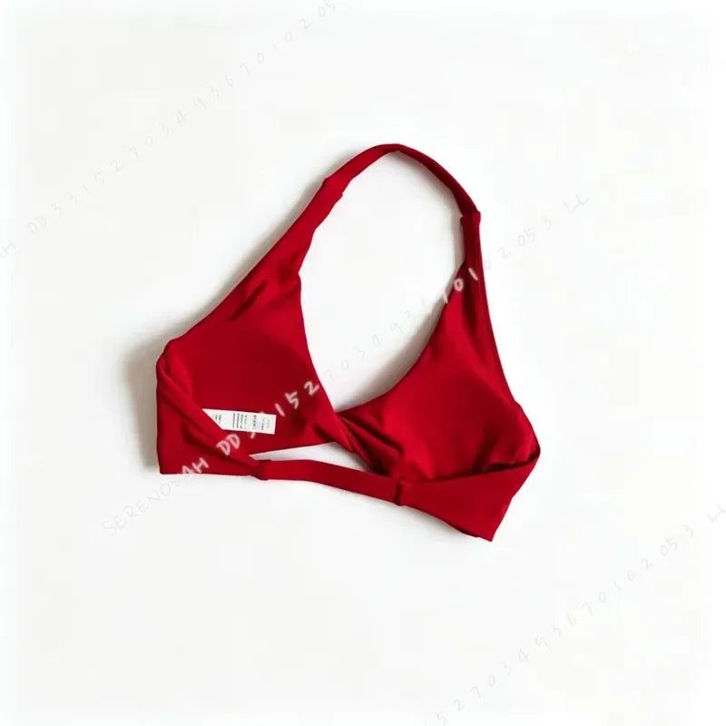 Scarlet red women's halter sports bra with open back by Corporación Turística, featuring supportive design for active wear.