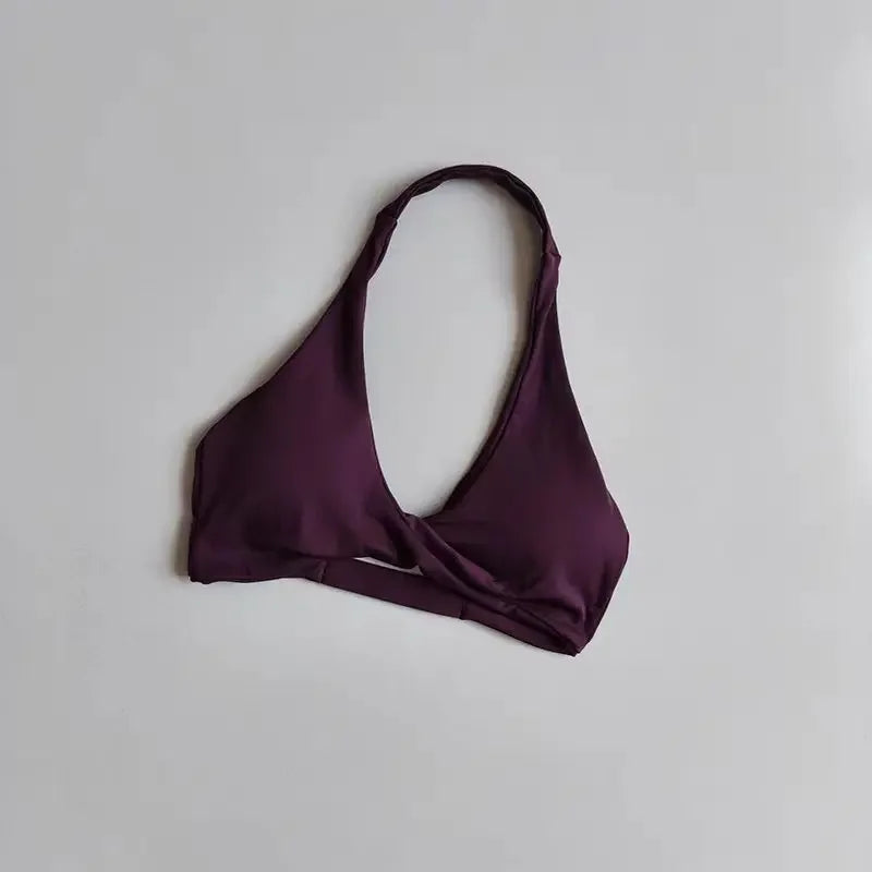 Scarlet red halter sports bra for women with open back, designed for active wear, by Corporación Turística.