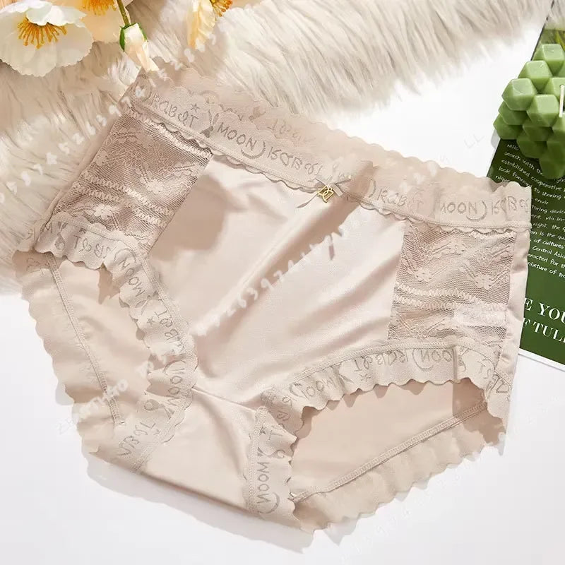 High-waisted lace panties for women in gray, seamless design by Corporación Turística, shown on a model.