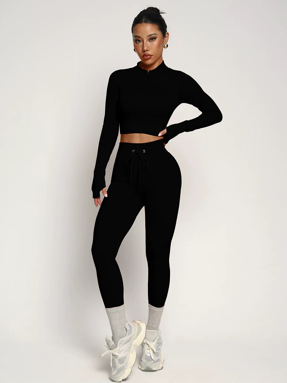 Fashionable two-piece yoga suit by Corporación Turística, featuring comfortable sportswear for active fitness and yoga practice.