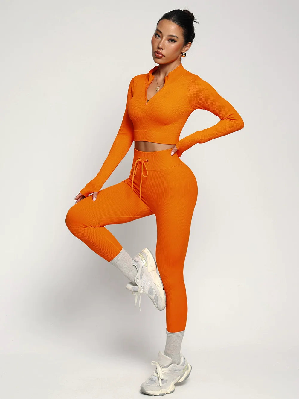 Fashionable two-piece yoga outfit from Corporación Turística, featuring a comfortable sportswear set for active wear.