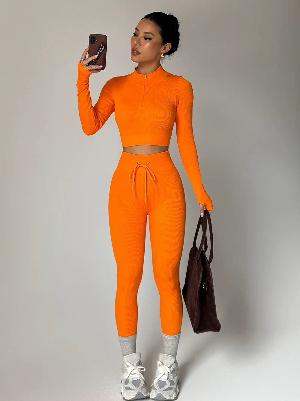 Stylish two-piece yoga outfit from Corporación Turística, featuring comfortable sportswear for active fitness and yoga sessions.