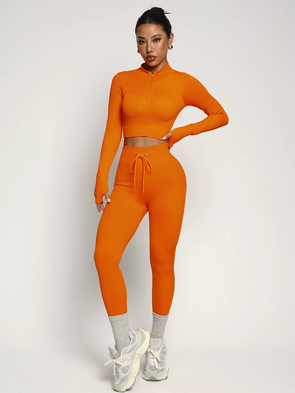 Fashionable two-piece yoga suit by Corporación Turística, sporty clothing for active wear, shown in black with a fitted design.