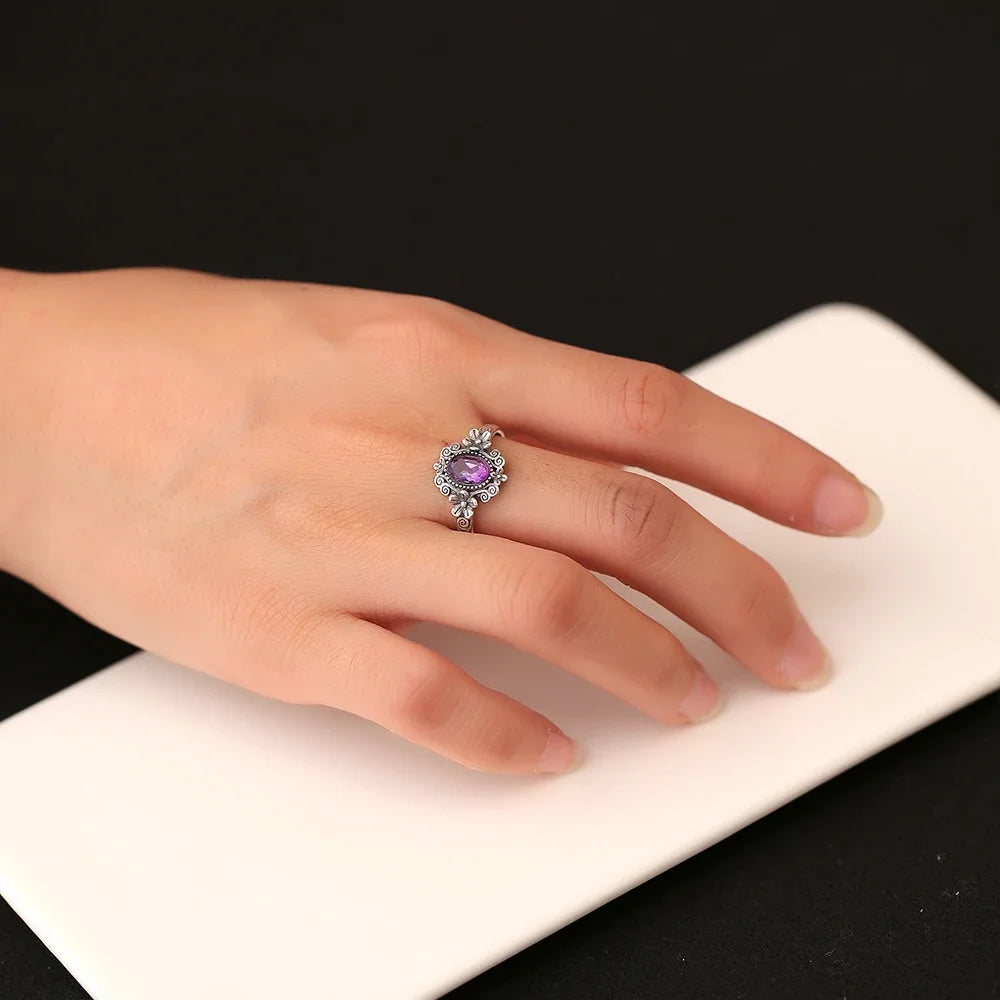 Sterling silver 925 amethyst ring with 7x5mm gemstone, showcasing vibrant purple color and elegant design.