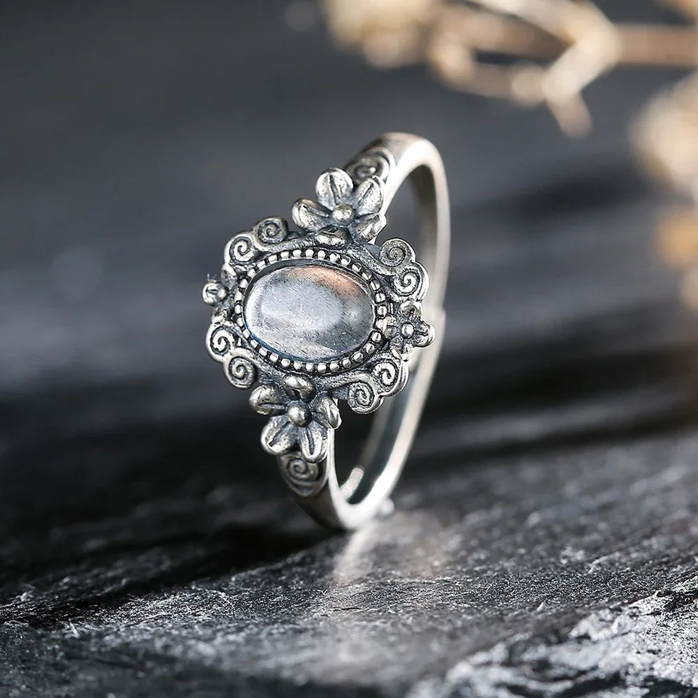 Sterling silver 925 amethyst ring with a 7x5mm oval gemstone, showcasing a vibrant purple hue and intricate design.