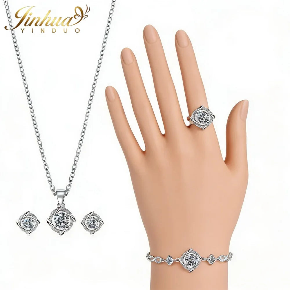 Classic 925 silver jewelry set with blue stone, featuring elegant design, displayed alongside a gauze bag, by Corporación Turística.