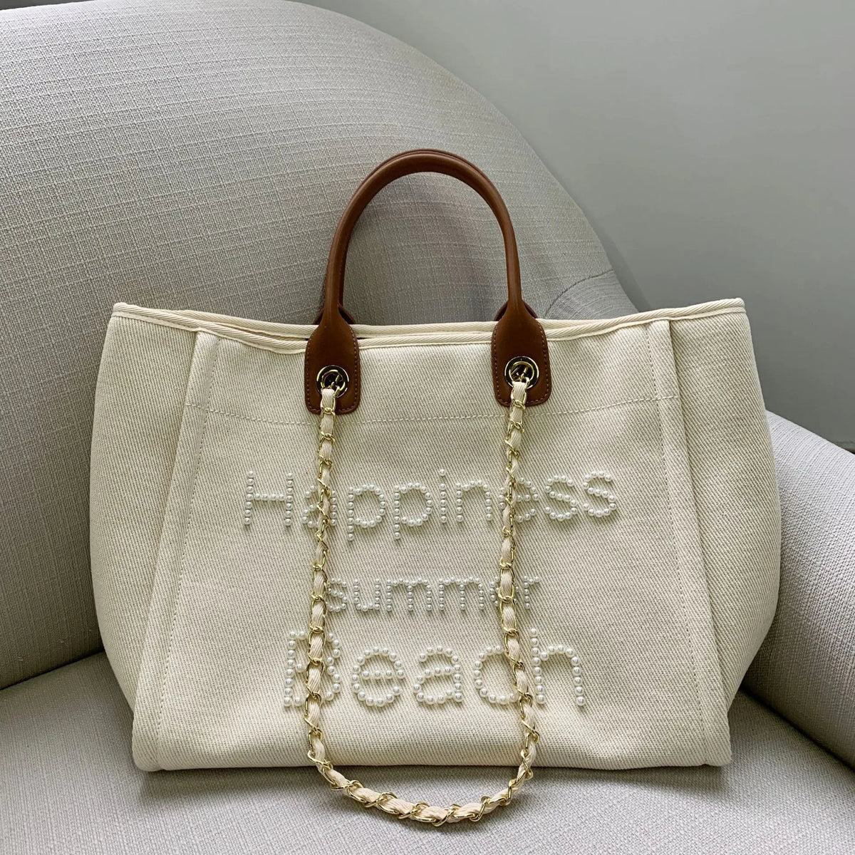 Large genuine leather tote bag for women by Corporación Turística, spacious canvas shoulder bag with leather accents.
