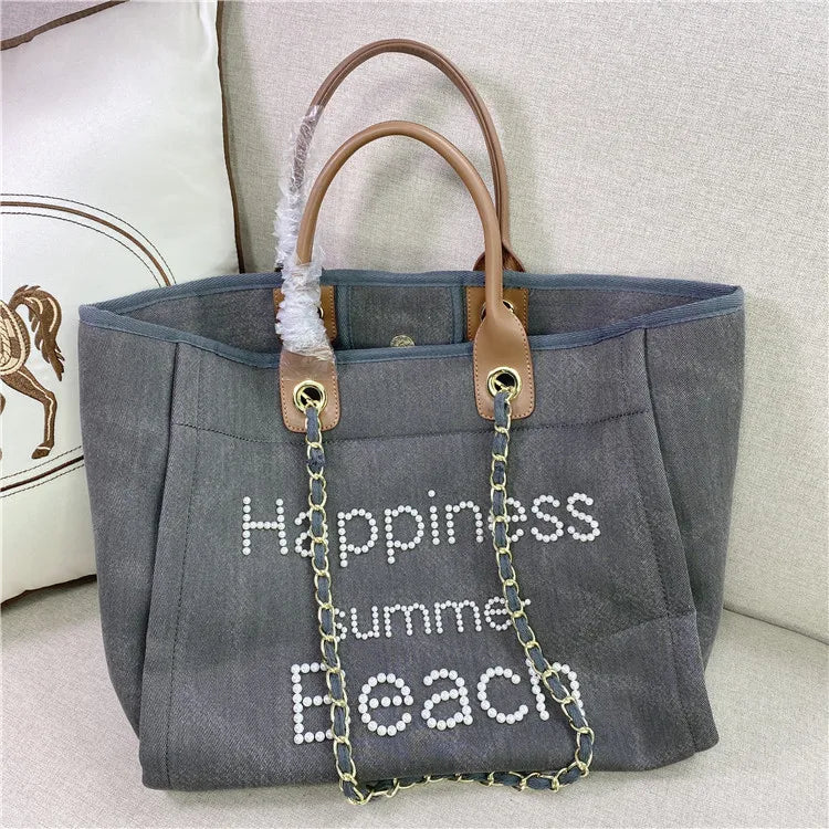 Large women's canvas and genuine leather shoulder bag by Corporación Turística, with spacious interior and stylish design.