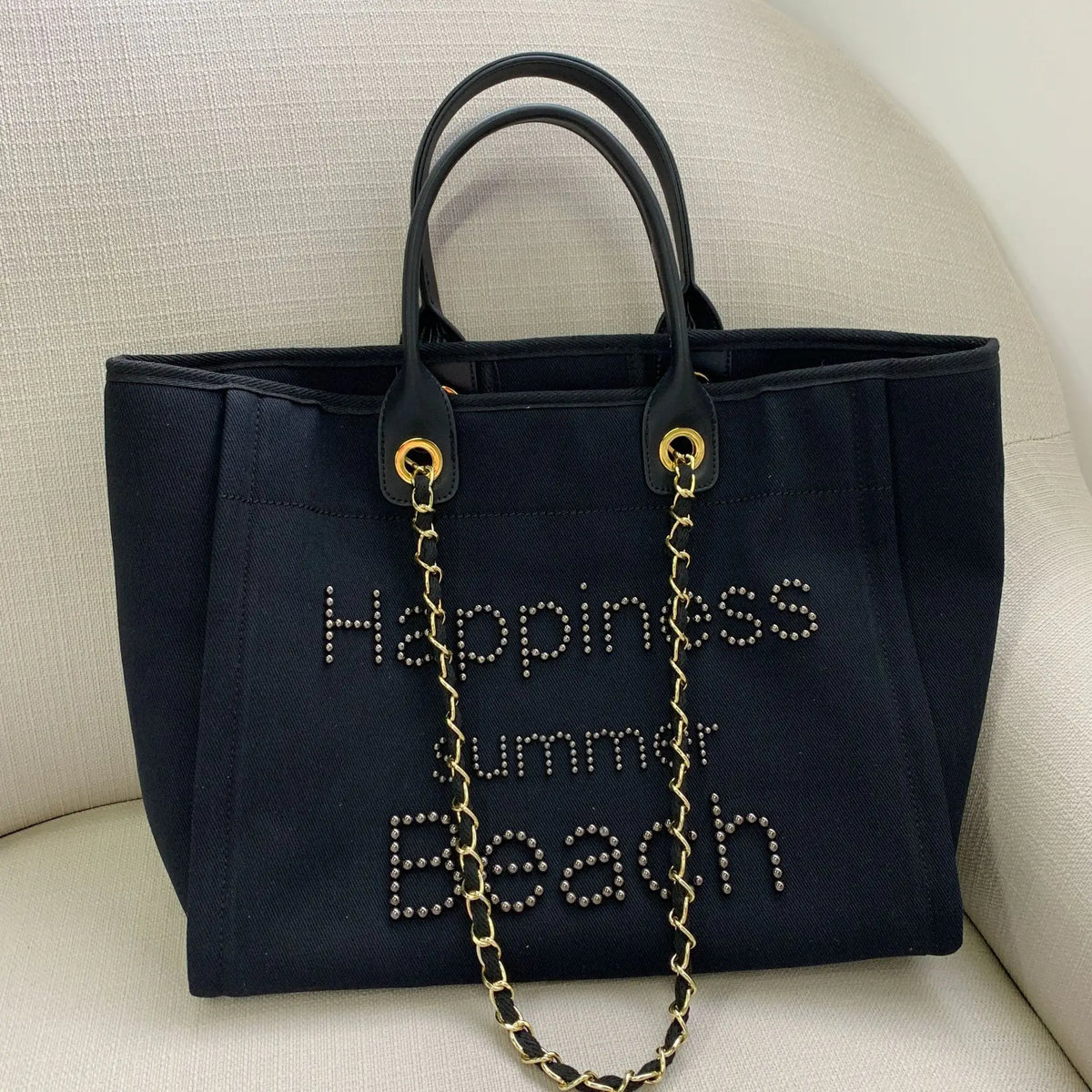 Large genuine leather tote bag for women with canvas body and shoulder strap, stylish and spacious for everyday use.