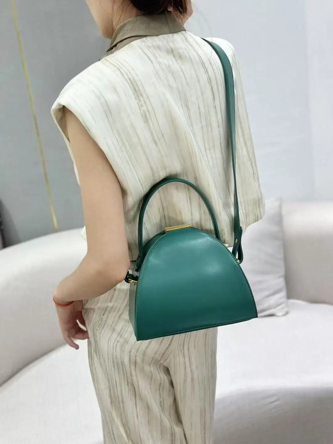 Gold PU shoulder bag for women with niche design, featuring a compact, stylish look and a structured shape.