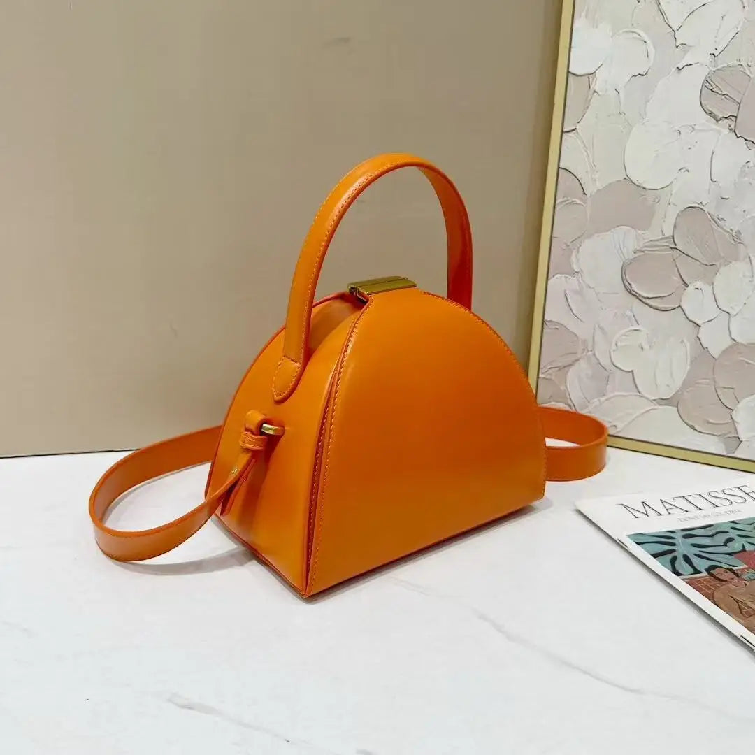 Gold PU shoulder bag for women with niche design, rectangular shape, from Corporación Turística, measuring 22x14x19cm.