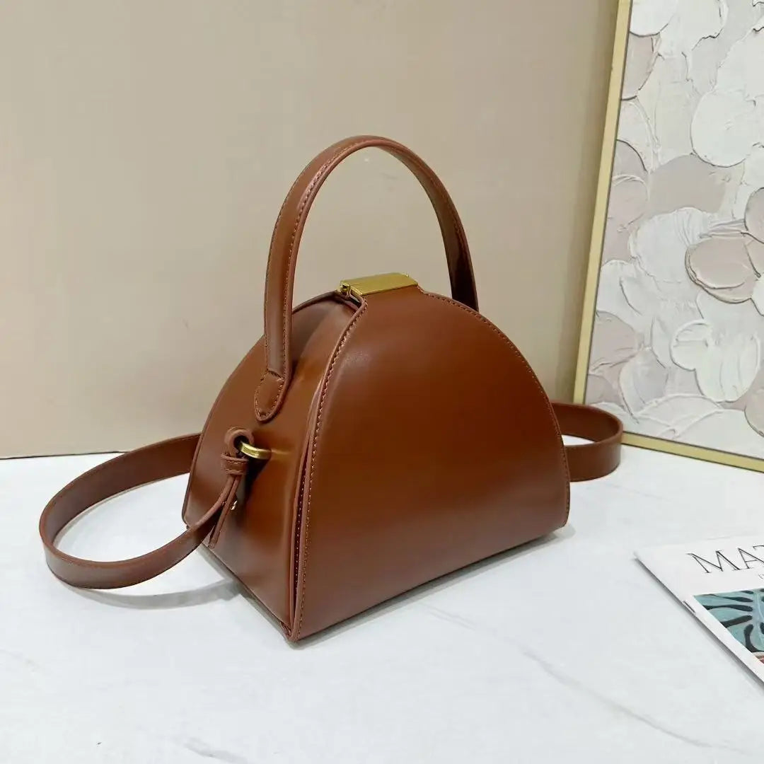 Gold PU shoulder bag for women with niche design, compact and stylish, from Corporación Turística.
