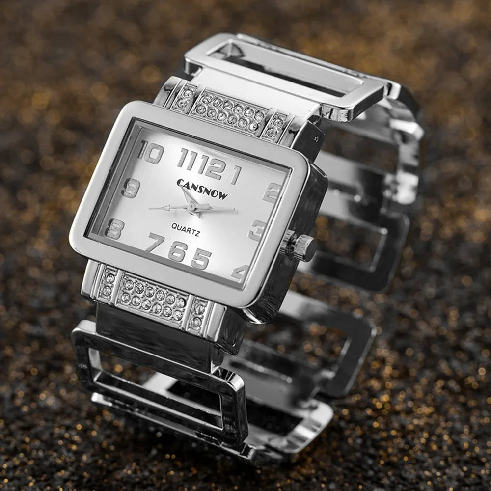 Gold and black rectangular Cansnow women's watch by Corporación Turística with a matching bracelet, stylish and elegant design.