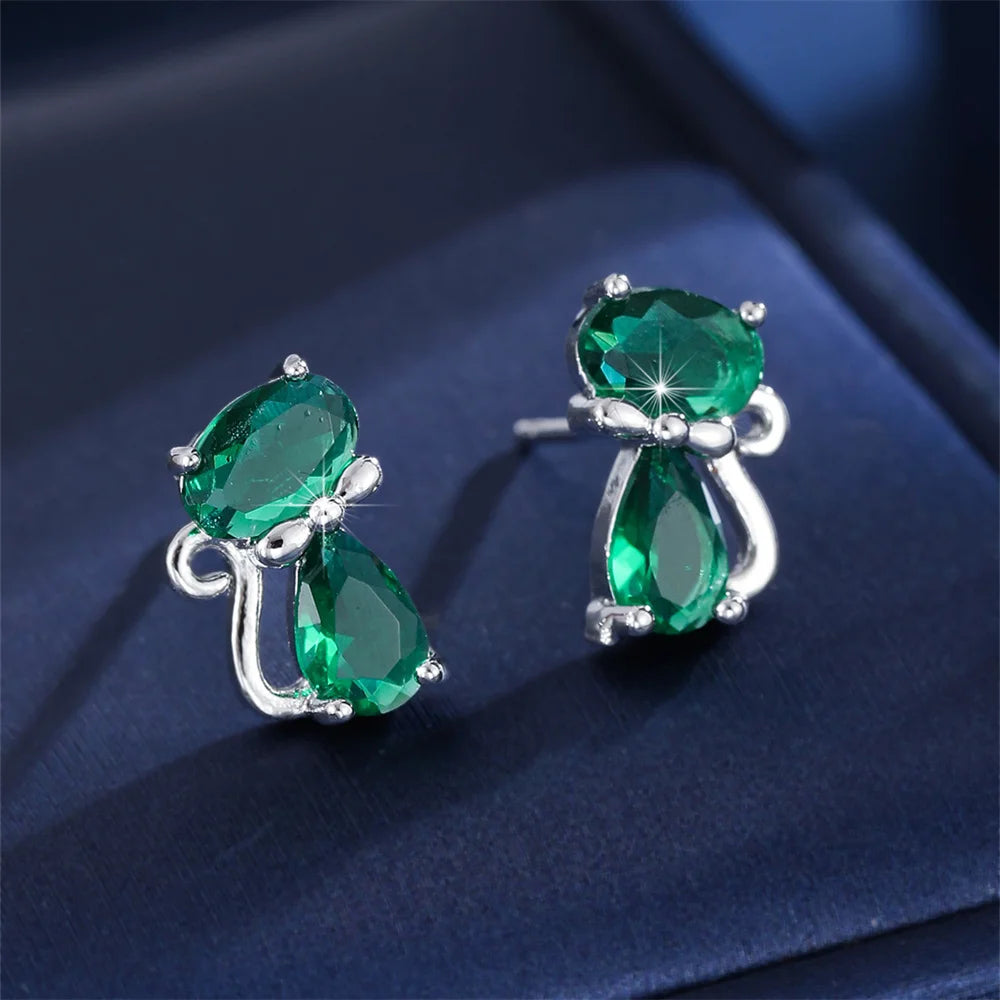 Small green cat-shaped earrings with zirconia accents from Corporación Turística, featuring a delicate and charming design.