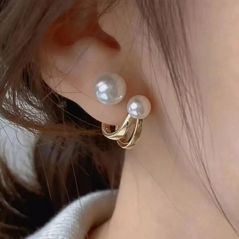 Gold and white Korean-style zircon dangling earrings with intricate design for women, featuring sparkling stones and elegant craftsmanship.