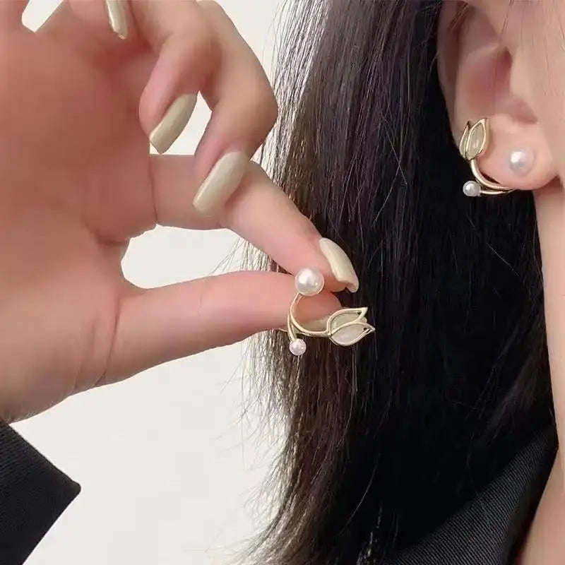 Gold and white Korean fashion zircon pendant earrings with dangling design, stylish jewelry for women.