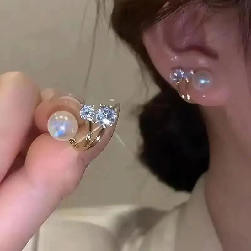 Gold and white Korean fashion zircon pendant earrings with dangling design, stylish jewelry for women.