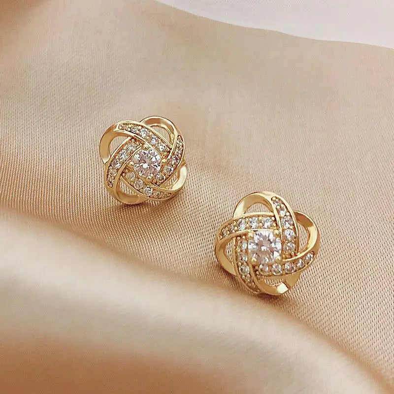 Gold and white Korean fashion zircon dangling earrings with intricate design, perfect for stylish women.