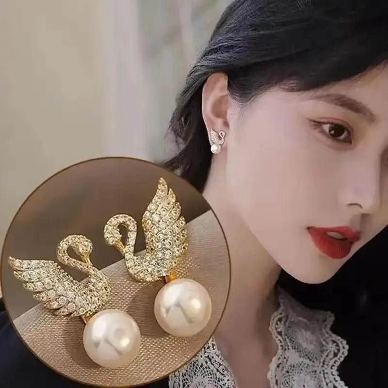 Gold and white Korean fashion zircon pendant earrings with dangling design, stylish jewelry for women.