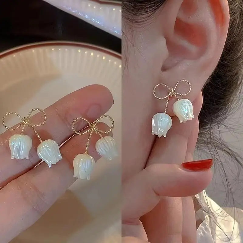 Gold and white Korean fashion zirconia dangling earrings with intricate design for women.