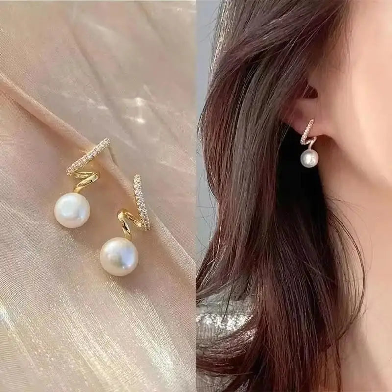 Gold and white Korean-style zircon dangling earrings, fashionable jewelry for women with elegant, sparkling design.