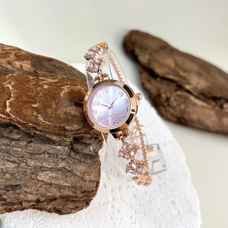 Elegant black adjustable bracelet watch with crystal cord from Corporación Turística, featuring a sleek design and gold accents.