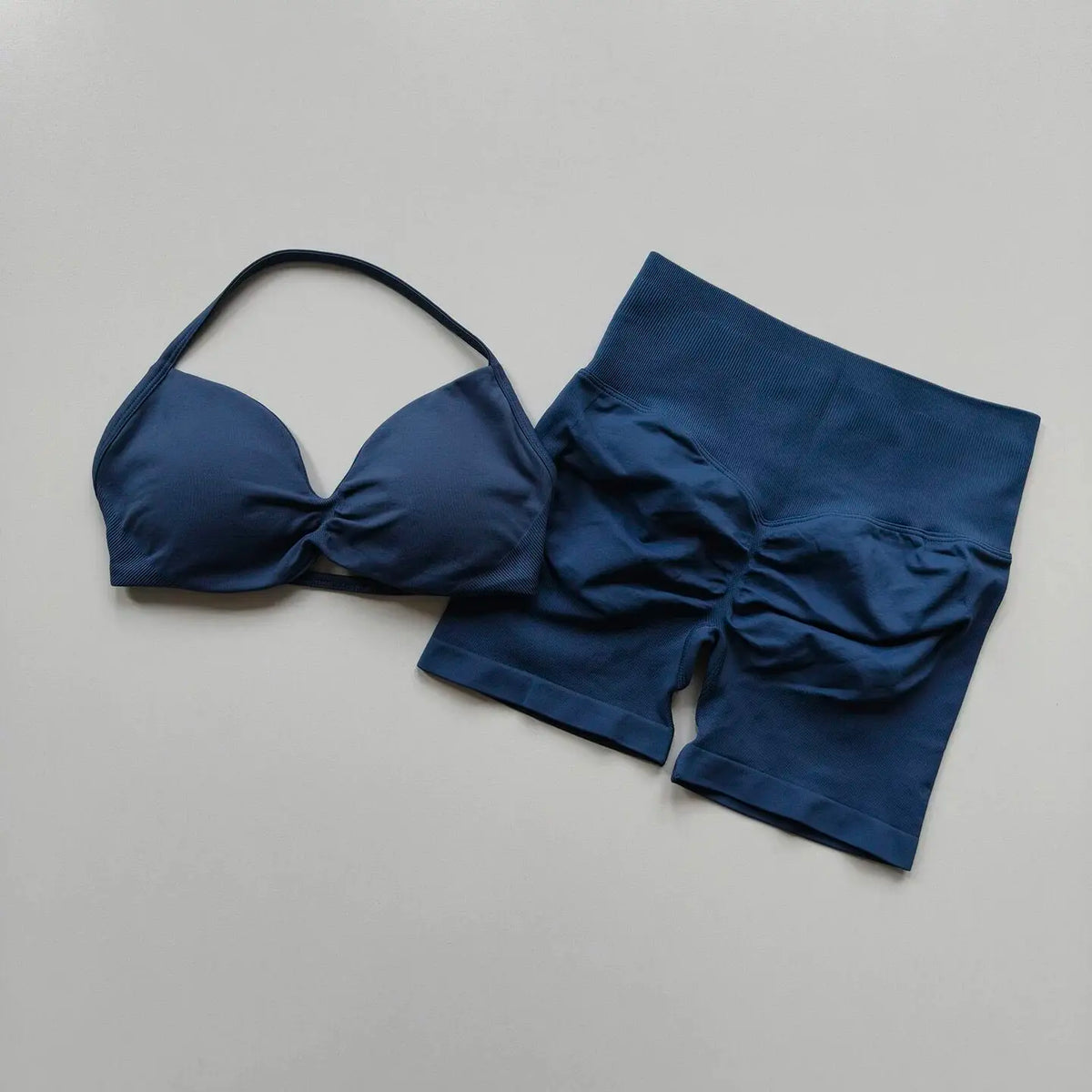 Purple women's yoga fitness set from Corporación Turística, breathable and comfortable for active exercise.