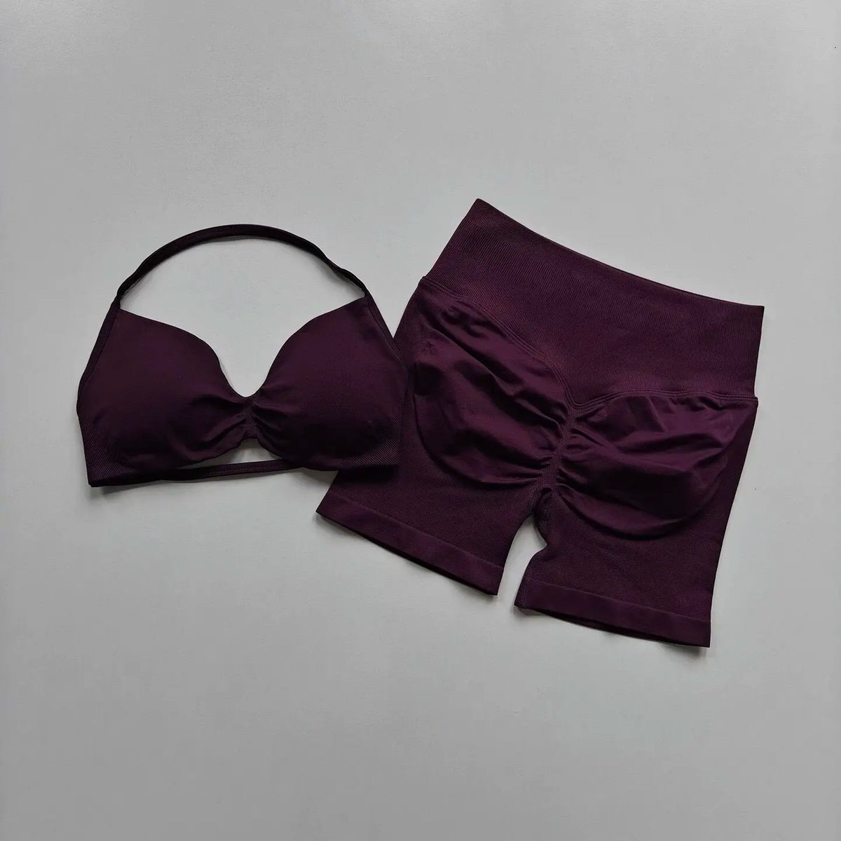 Purple women's yoga fitness set by Corporación Turística, breathable and comfortable for exercise and relaxation.