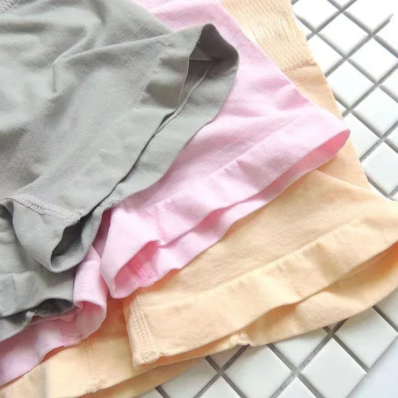 Four gray women's fitted safety shorts from Corporación Turística, designed for secure comfort and support.