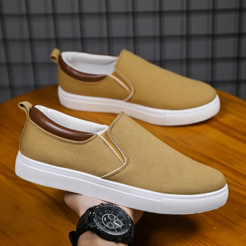 Gray Feerldi men's casual lightweight shoes by Corporación Turística, showing the comfortable slip-on design and soft fabric material.